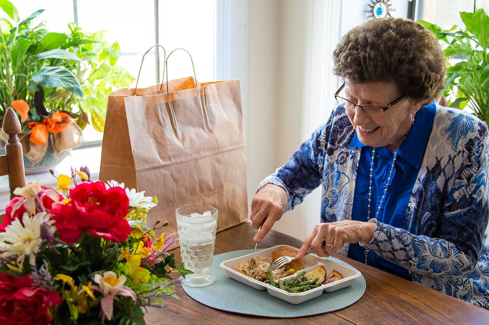 Woodruff enjoys one of the delivered meals. (Photo by David Ammon)