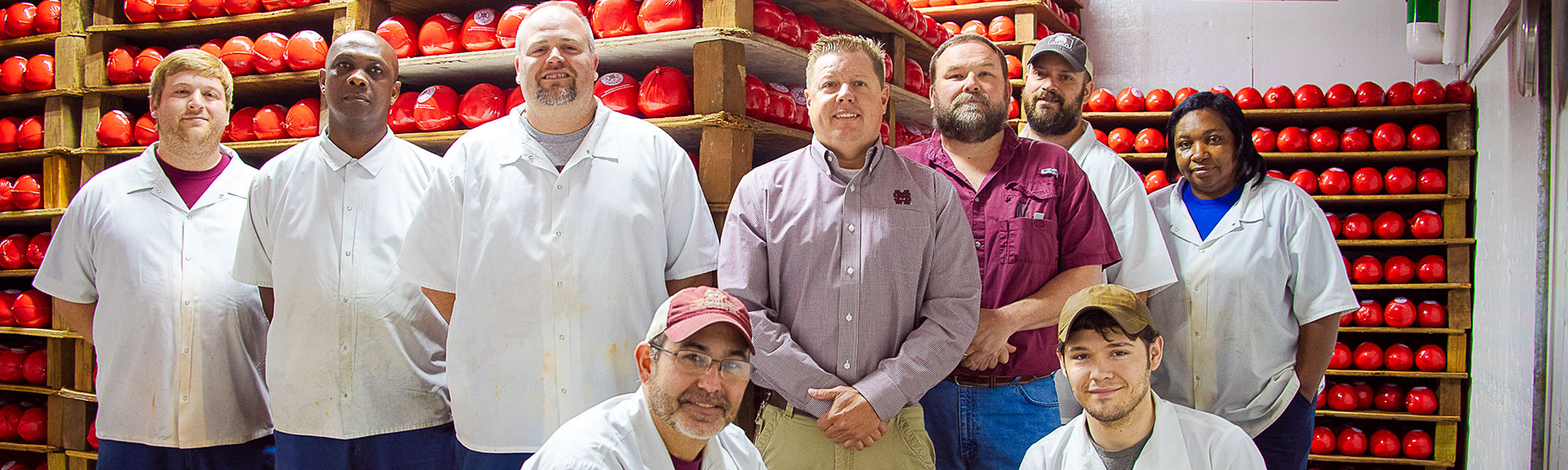 Custer Dairy Processing Plant staff in front of Edam