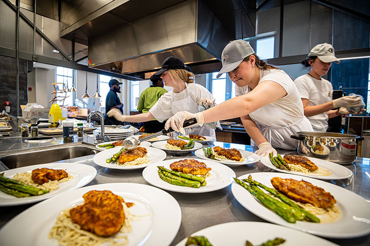 Food science students preparing a meal. 