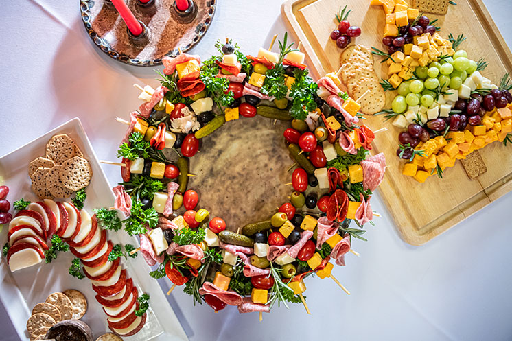 cheese and pepperoni candy cane, cheese and grape Christmas tree, Cheese and vegetable skewers in a wreath shape